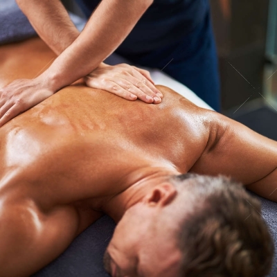 114994129-close-up-of-masseur-hands-massaging-client-back-while-he-lying-on-massage-table-r_0hpo67Q-transformed