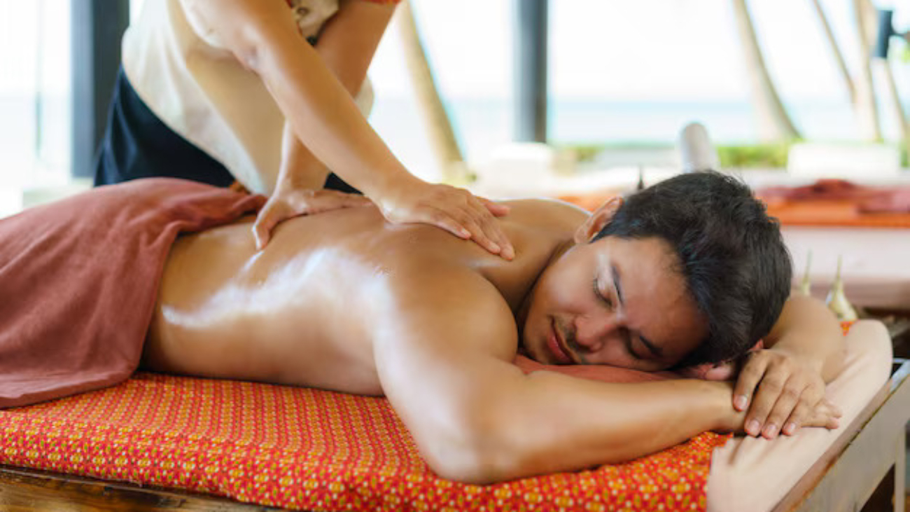 asian-man-beach-spa-salon-getting-oil-massage-near-beach-looking-happy-thailand_73503-2915
